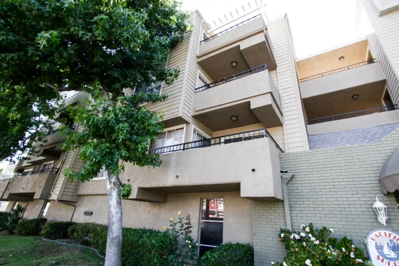 Balconies with metal rails extend from Pacific Shores