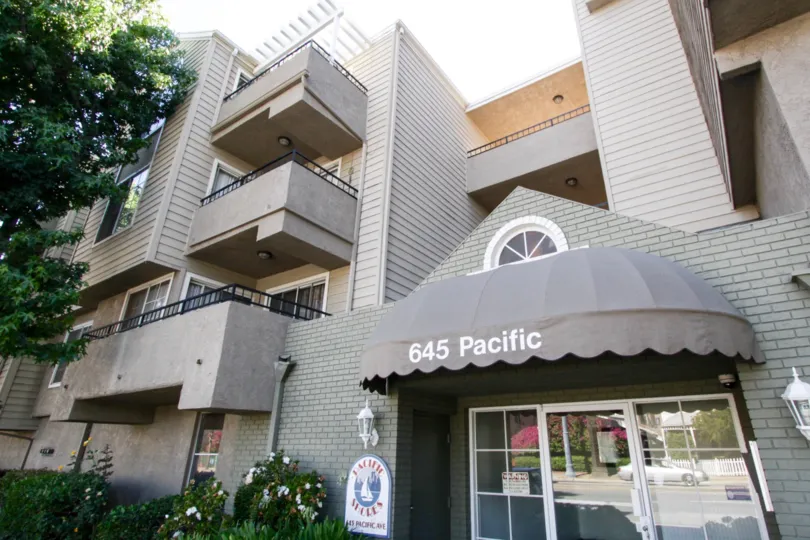 A Pacific Shores marquee is mounted next to the entry