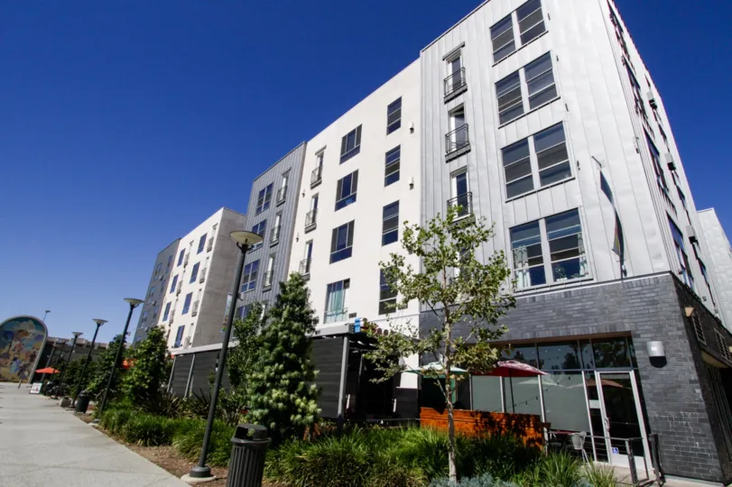 Promenade Walk modern condo building with stone and metal accents