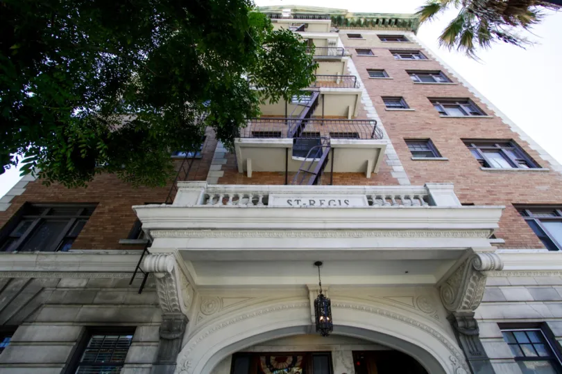 A fire escape is on the front center of the St Regis building