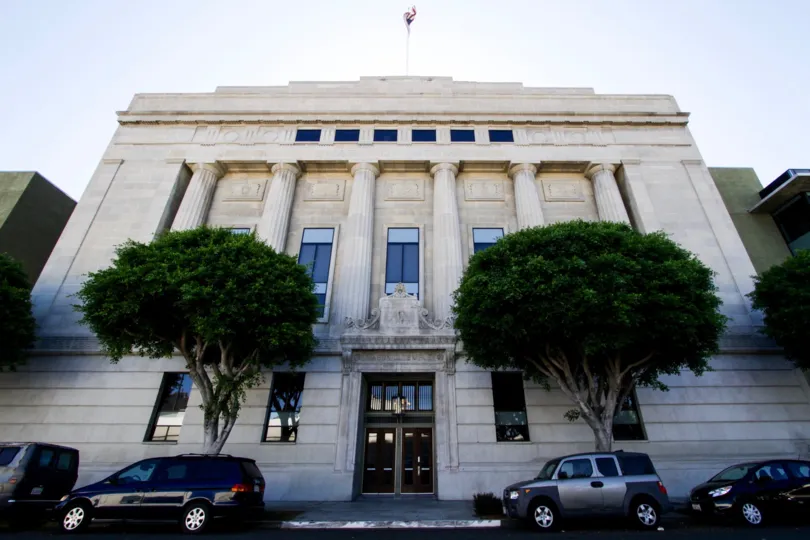 An American flag stands atop the Masonic temple adjacent to Temple Lofts