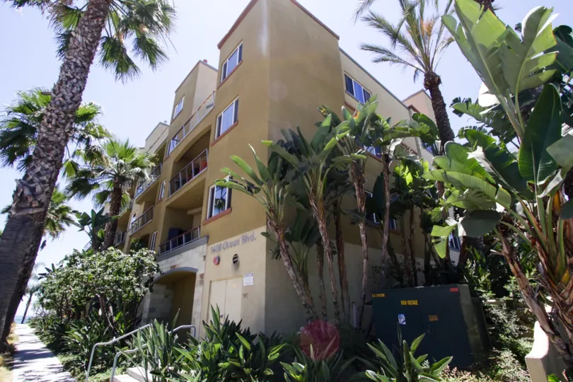 Tropical landscaping surrounds The Meridian property