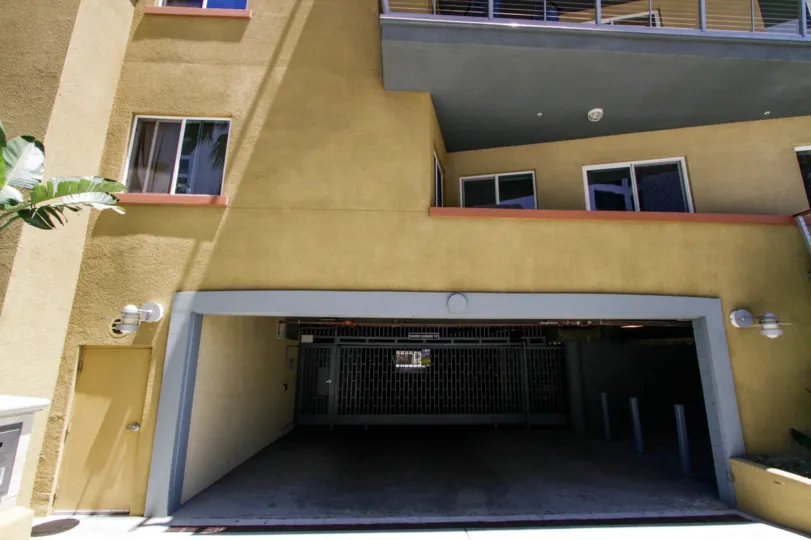 Gated parking garage entrance to The Meridian