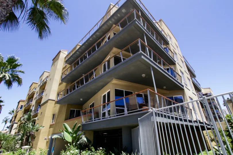 Corner balconies wrap around the sides of The Meridian with ocean views