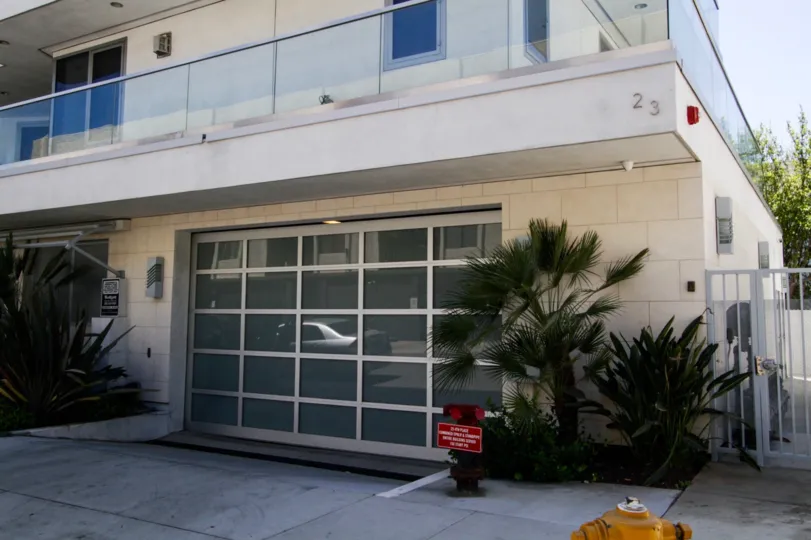 A frosted glass garage door at The Oceanside garage entrance