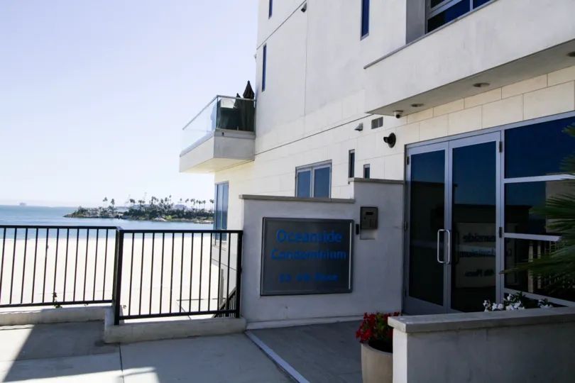 Marquee to The Oceanside with ocean view in background