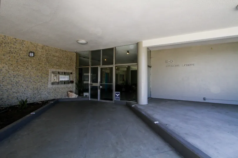 Entrance through glass doors to The Royal Palms