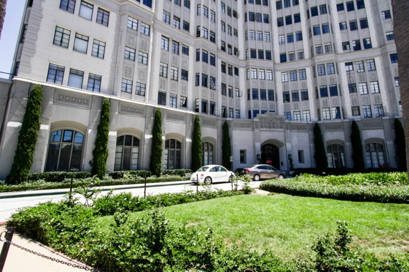 Cars parked near entry to Villa Riviera