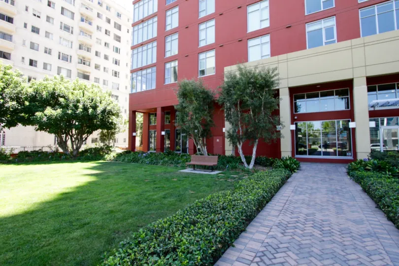 A grassy lawn at the entry to West Ocean Towers