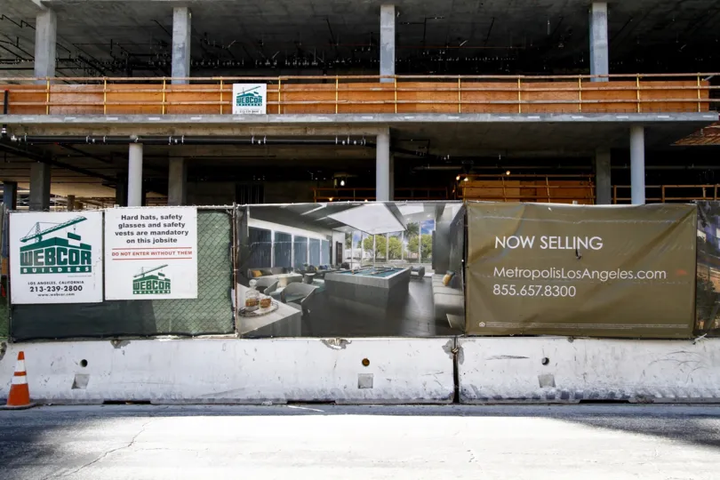 The now selling sign in front of the Metropolis in Downtown LA