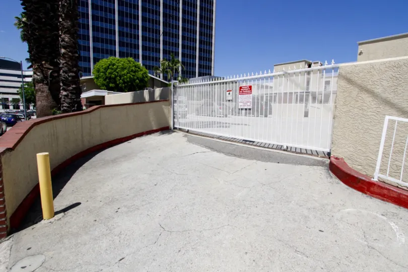 The private parking lot of 4610 Densmore Ave