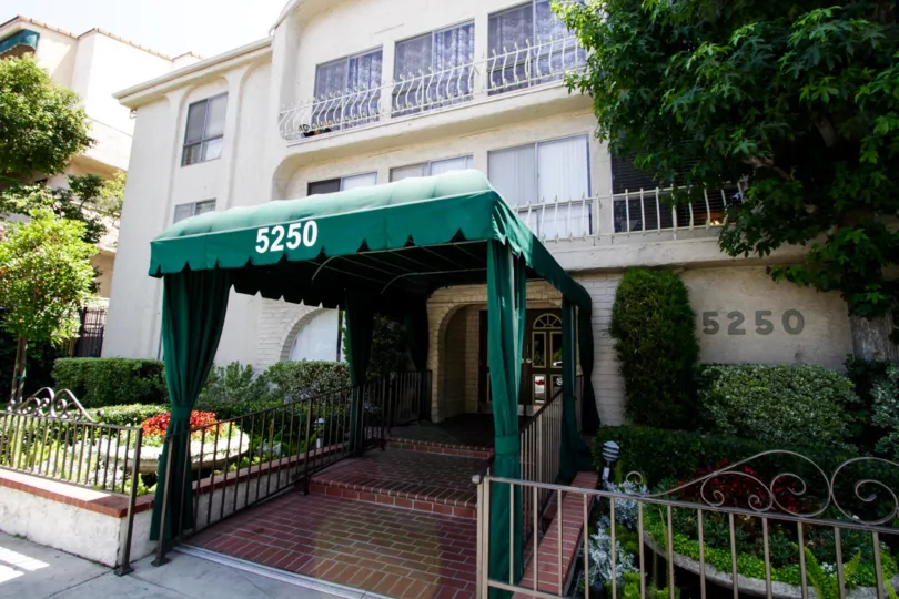 The brick path entrance into the building at 5250 Zelzah Ave