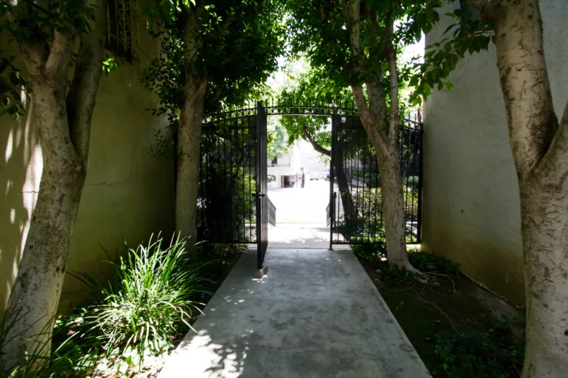 The gated entrance leading into the common area of Encino Gardens