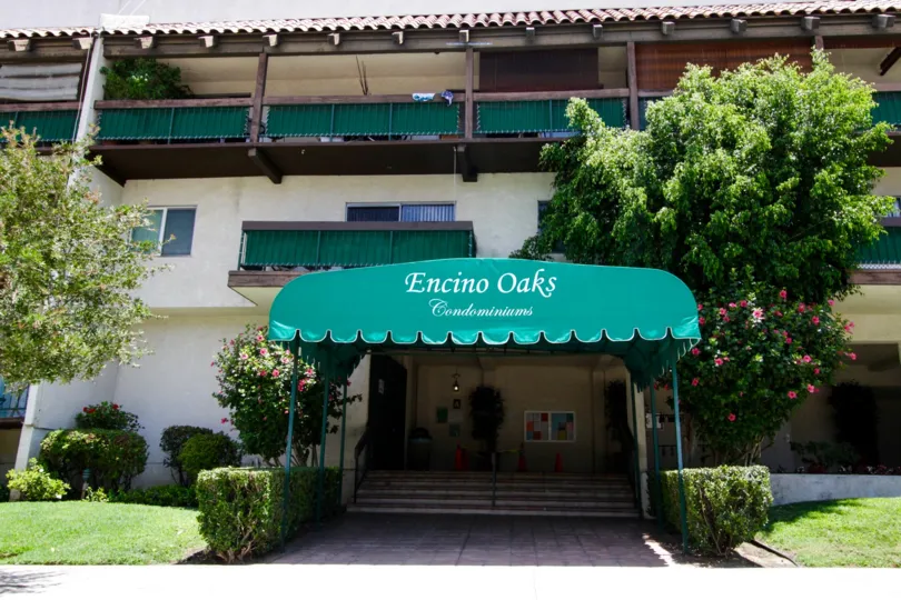 The covered entrance into the Encino Oaks building