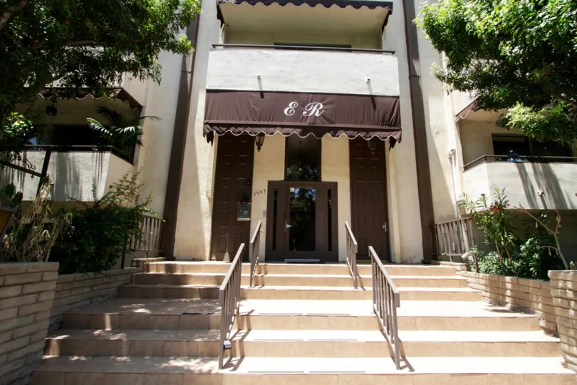 The stone stairs leading to the entrance of the Encino Regency in Encino