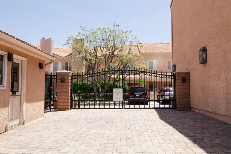 The closed parking gate for the Four Oaks complex in Encino