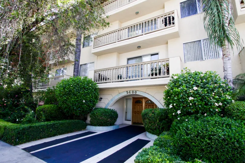 The royal blue walkway to the entrance of Ports of Call Condominiums