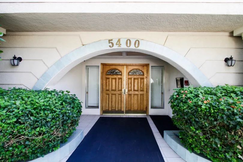 The double door entrance of the Ports of Call Condominiums
