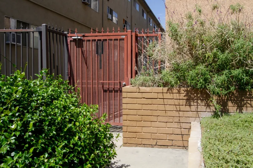 The gated side entrance of Shelbourne Towers