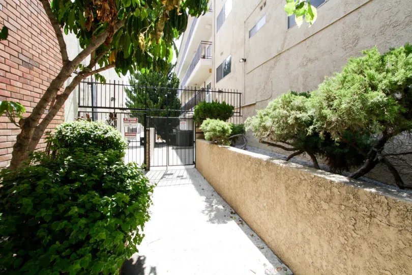 The gated side entrance into The Lindley