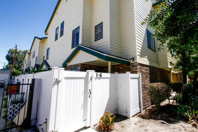The fence around the units at 322 Raymond Ave