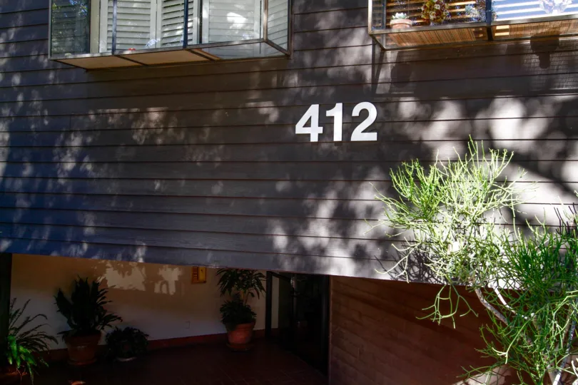 The address written on the building at 412 N Kenwood St