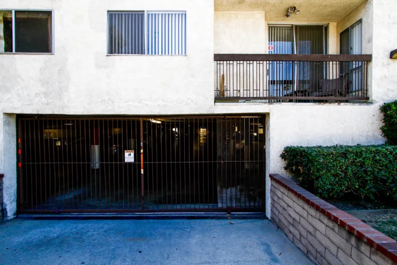 The gate entry into the parking for 570 W Stocker St