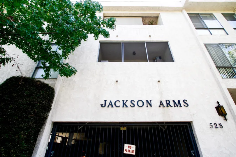 The name of Jackson Arms written on the building