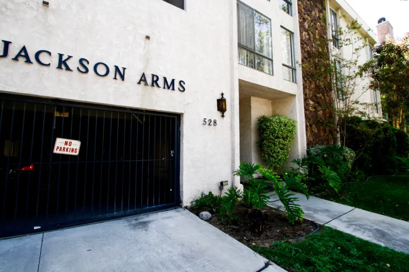 The address of Jackson Arms on the building