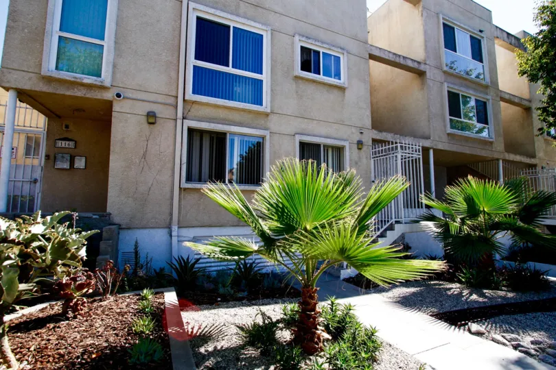 The sidewalk up to Maple Condos