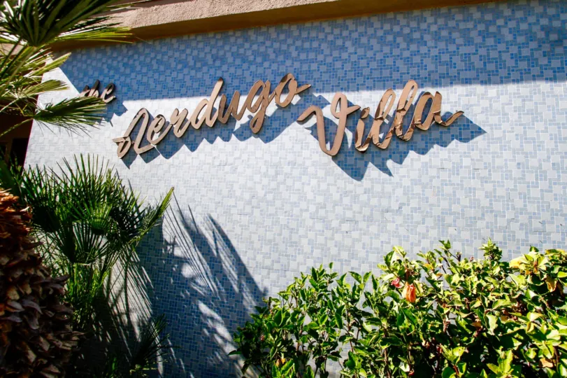 The Verdugo Villa name on the building in Glendale California