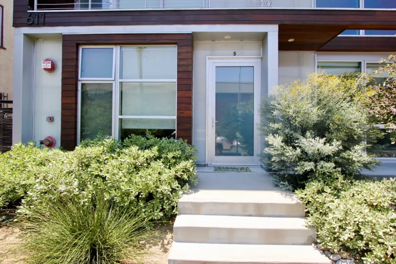A view of the front of this house in the 611 Bronson community on a sunny day