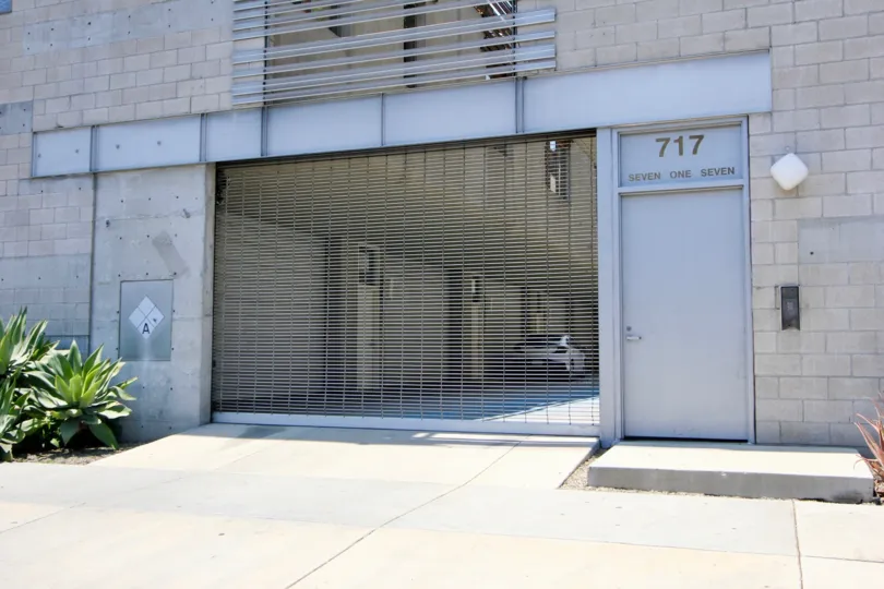 Grated light gray with very solid form of a white brick building garage