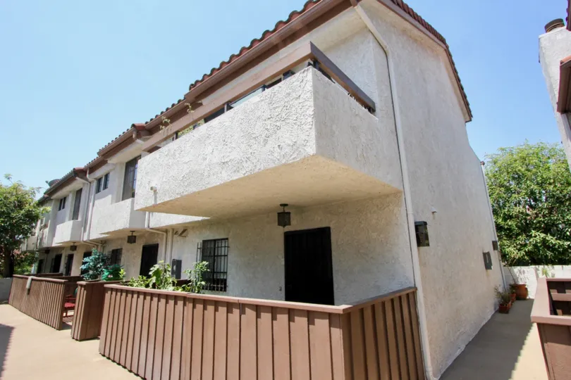A bright day in the Chateau Marmont with the side view of a house.