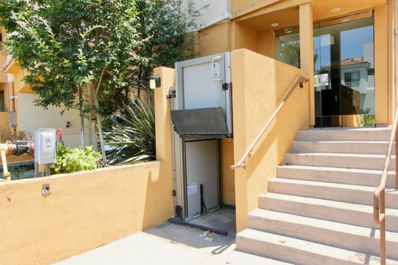 The orange walls and stairway of the Larchmont Villa in Hancock Park California.