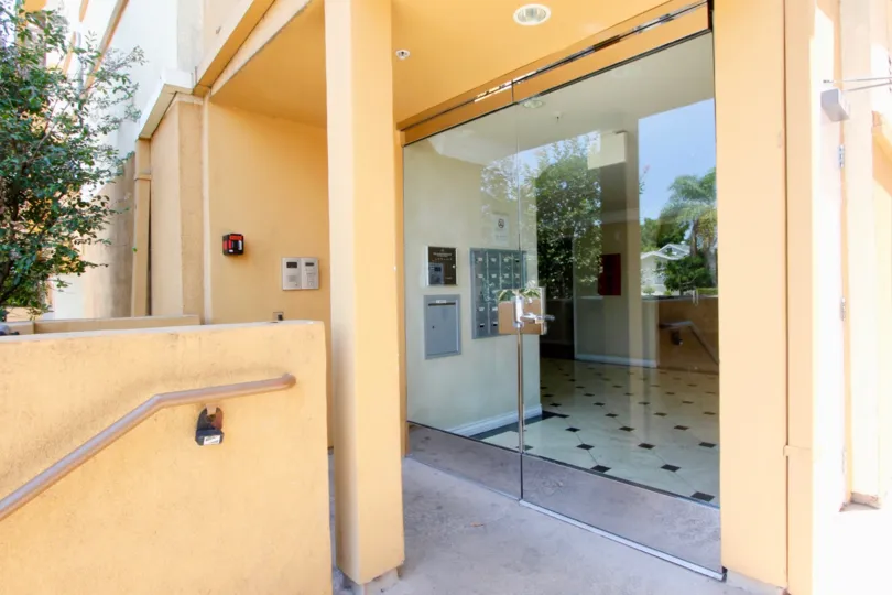 A sunny day at the Larchmont Villa, surrounded by lush trees