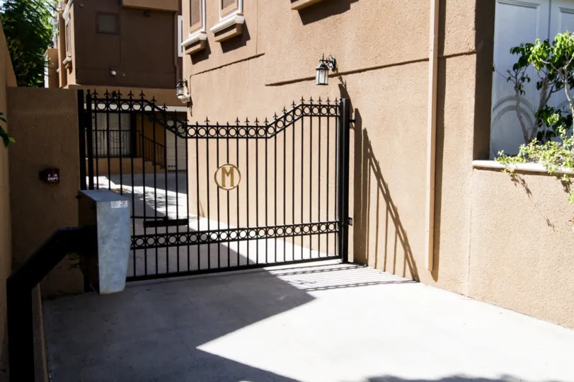 The side gate for Marbella Terraces West in Hancock Park