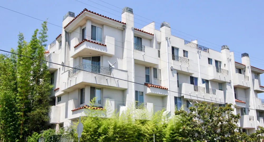 A sunny day over the Norton townhouses and its terra cota roof tiles in hancock park california.