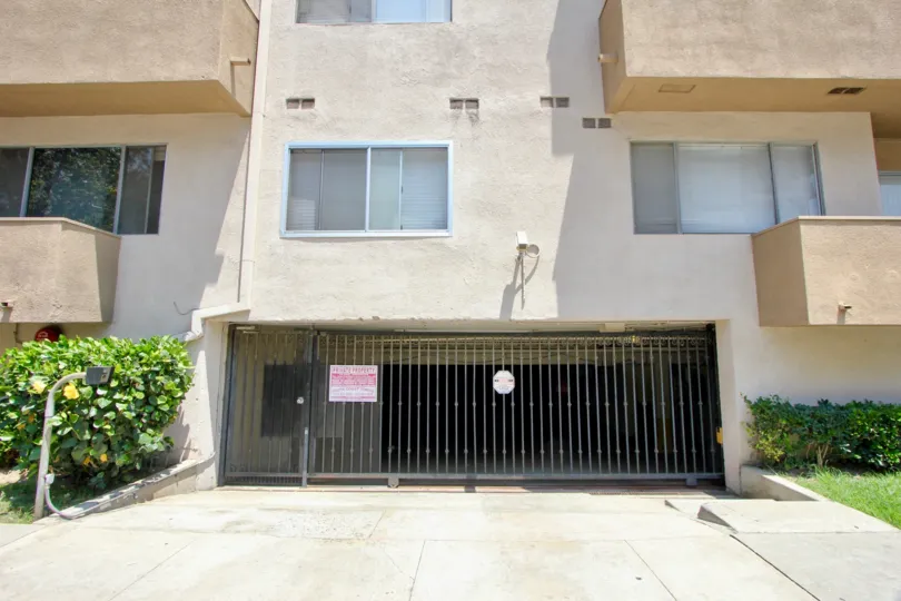 Parking entrance at San Marcus with security camera and call box. Personal terraces and big windows.