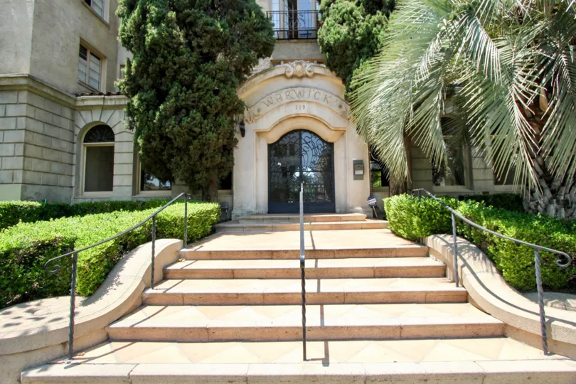 A sunny day in the The Warwick with some steps and palace front.