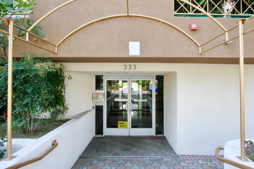 The front entrance of Westminster Village with glass doors closed