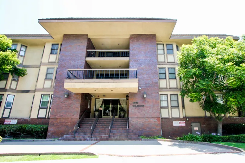 It is a hotel or apartment having big enterance with two floor