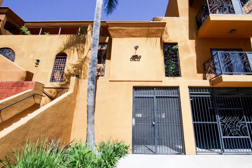 Artistic wrought iron work covers the entry to 828 Hudson