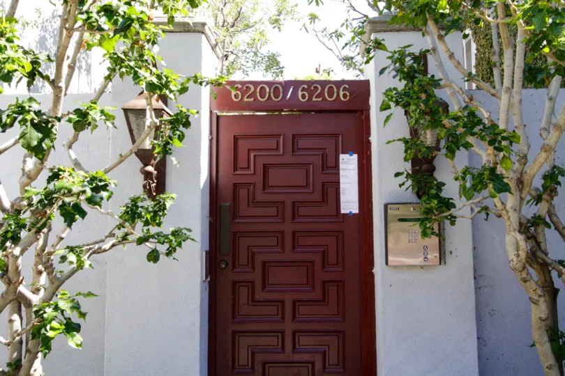 A wood door leads to the Banner Manor entry