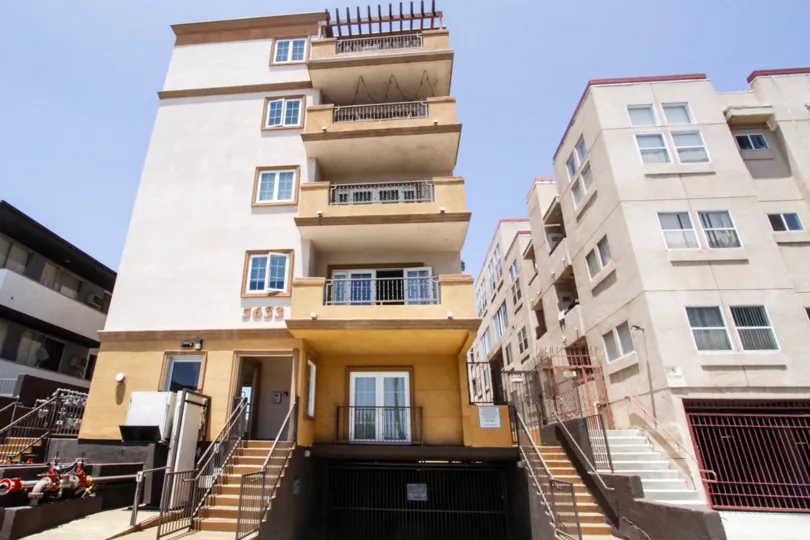 The front exterior of Carleton Crest shows each balcony front entrance and garage