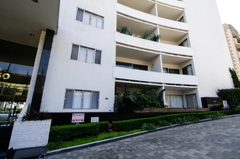 The Franklin Towers driveway is made of grey paver stones