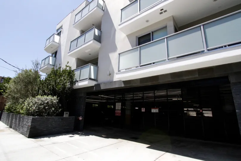 The gated parking garage to entry Hawthorn in Hollywood is center to the building