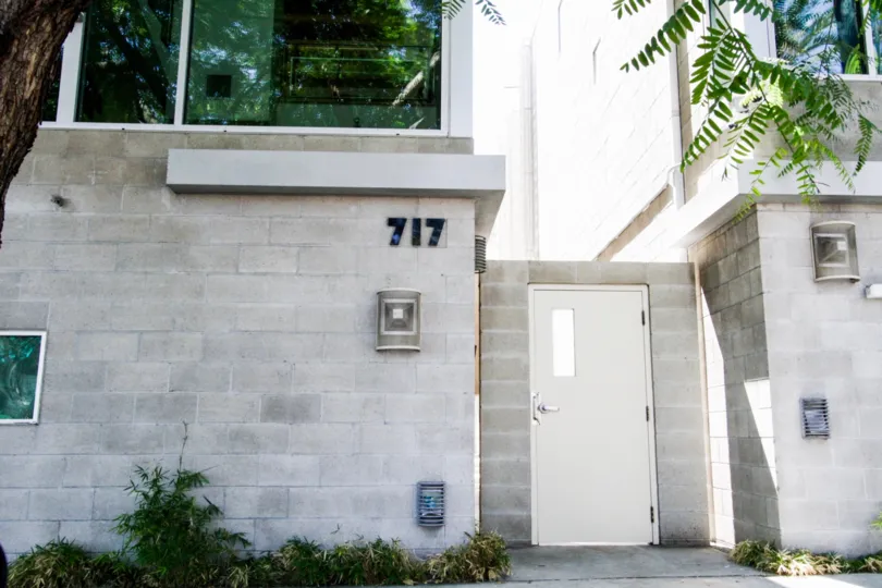 A solid steel pedestrian door lead to a side entrance of Hawthorn in Hollywood