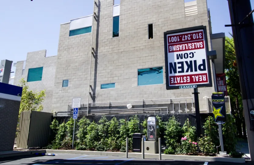 A side view of Highland Lofts showing it is a multi-story building made of cinderblock
