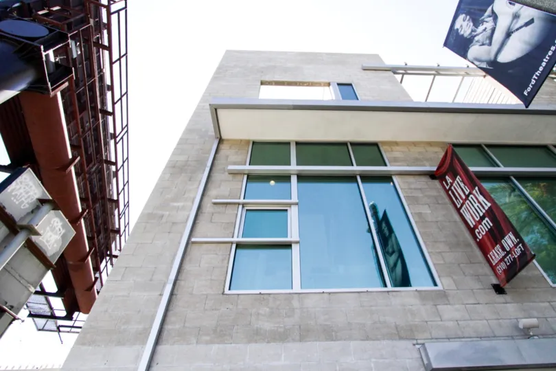 Staring directly up at Highland Lofts shows the large windows and block construction of the building